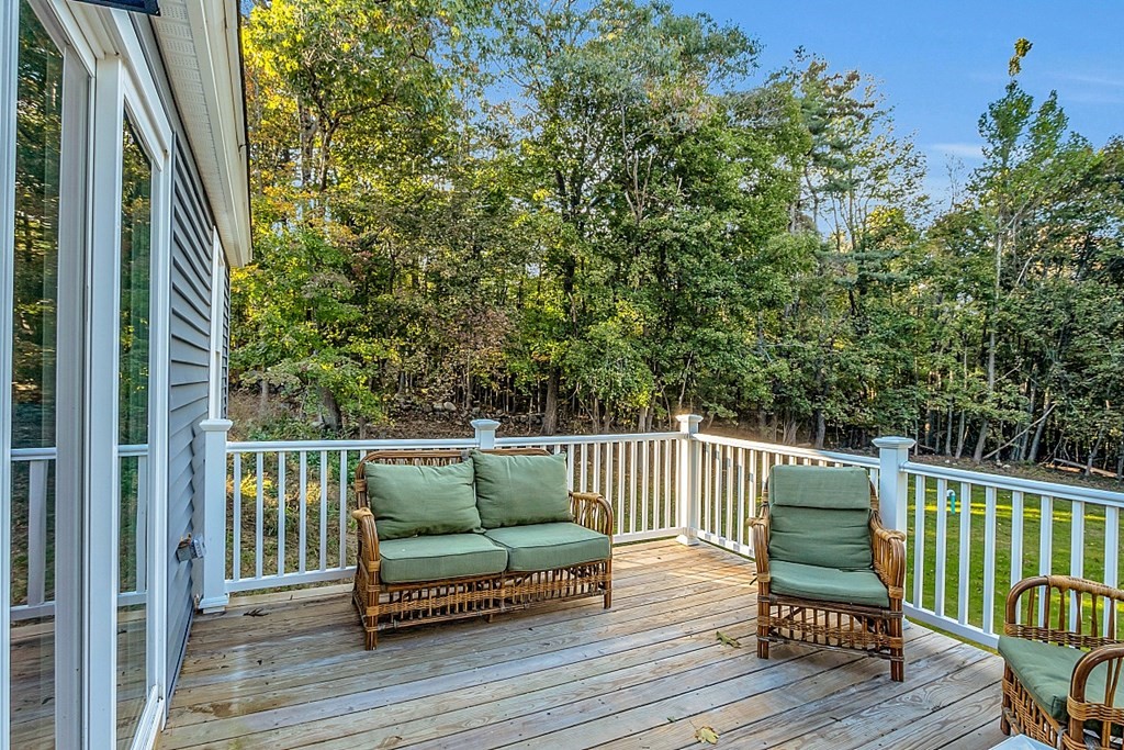 102 Turnpike Road Ashby, MA 01431 - Photo 33 of 40 a balcony with wooden floor table and chairs