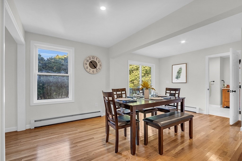 102 Turnpike Road Ashby, MA 01431 - Photo 8 of 40 a view of a dining room with furniture and wooden floor