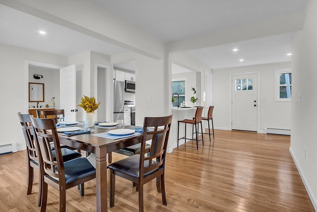 102 Turnpike Road Ashby, MA 01431 - Photo 10 of 40 a view of a dining room with furniture and wooden floor