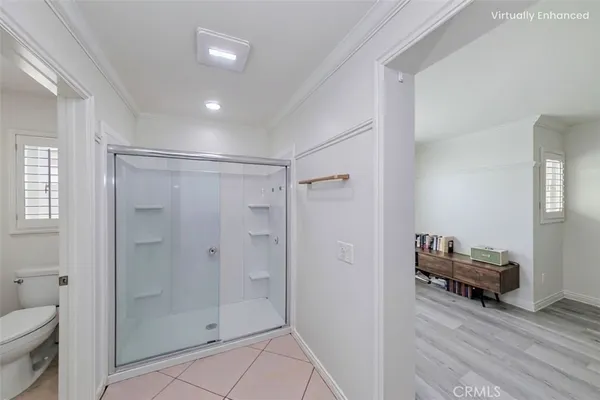 a view of a bathroom with mirror