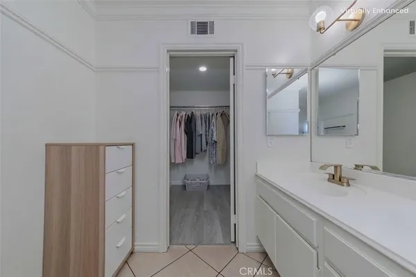 a bathroom with a sink a shower and a mirror