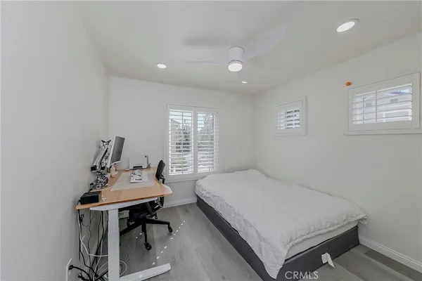 a bedroom with a bed and a table