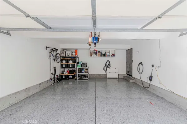 a view of a room with lots of white furniture