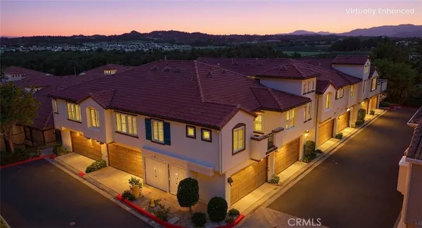 a view of a big house with a mountain