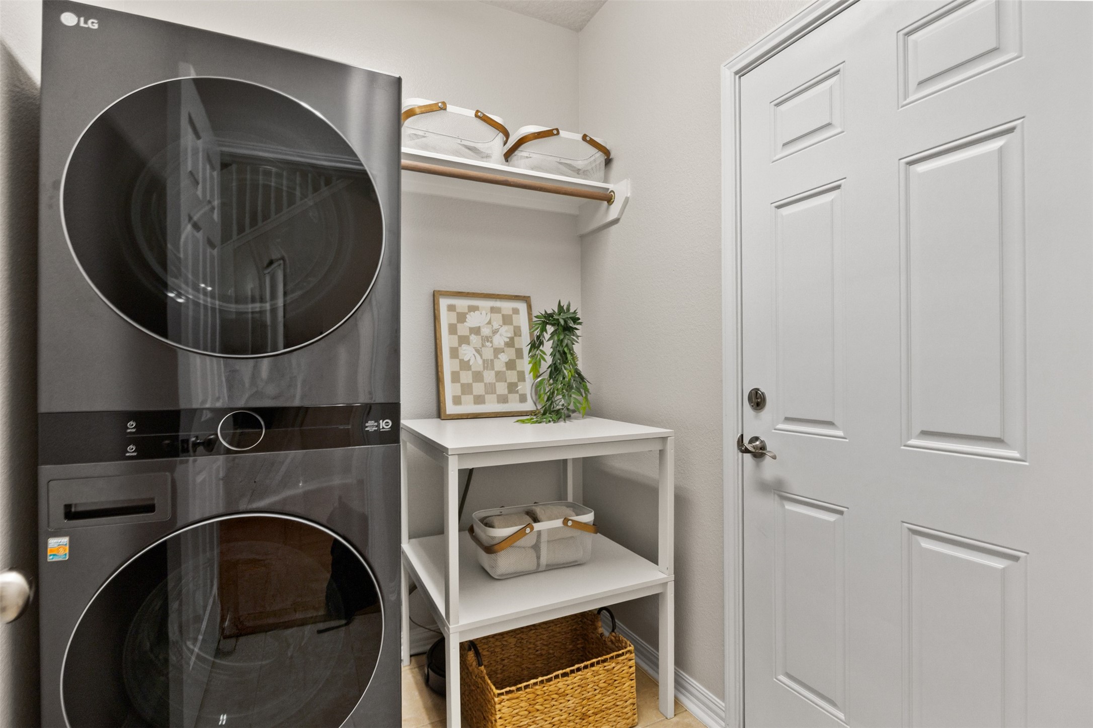 2219 Louetta Brook Lane Spring, TX 77388 - Photo 18 of 34 Laundry room with built-in shelving and space for washer and dryer.