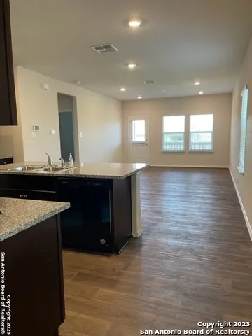 a kitchen with a sink and cabinets