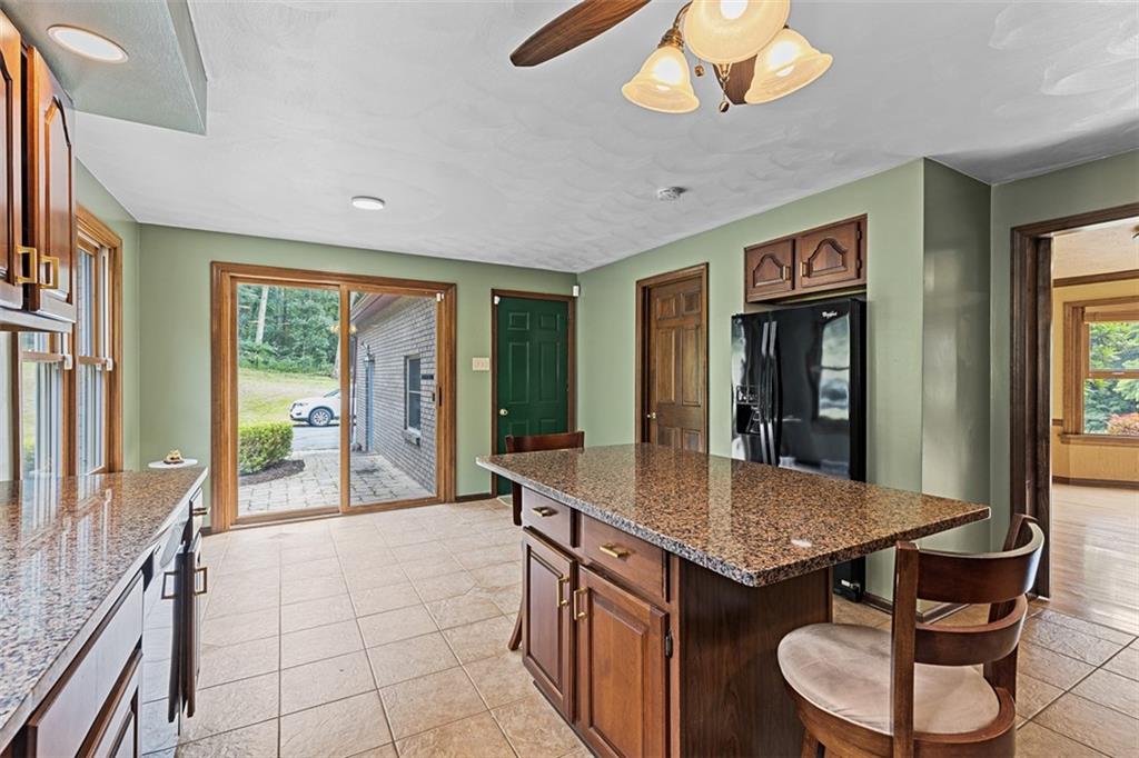 5150 Mamont Road Murrysville, PA 15668 - Photo 12 of 50 a kitchen with stainless steel appliances granite countertop a sink and a refrigerator
