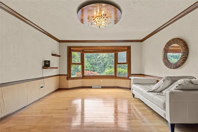 a spacious bedroom with a bed and a large window