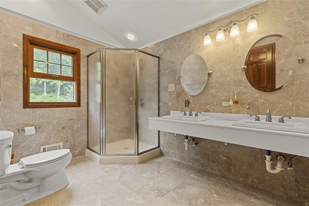 5150 Mamont Road Murrysville, PA 15668 - Photo 20 of 50 a bathroom with a double vanity sink mirror and toilet