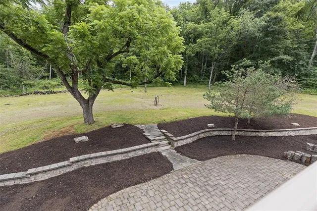 a backyard of a house with lots of green space