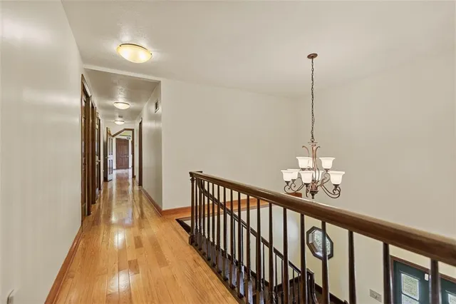a view of a hallway with the chandelier