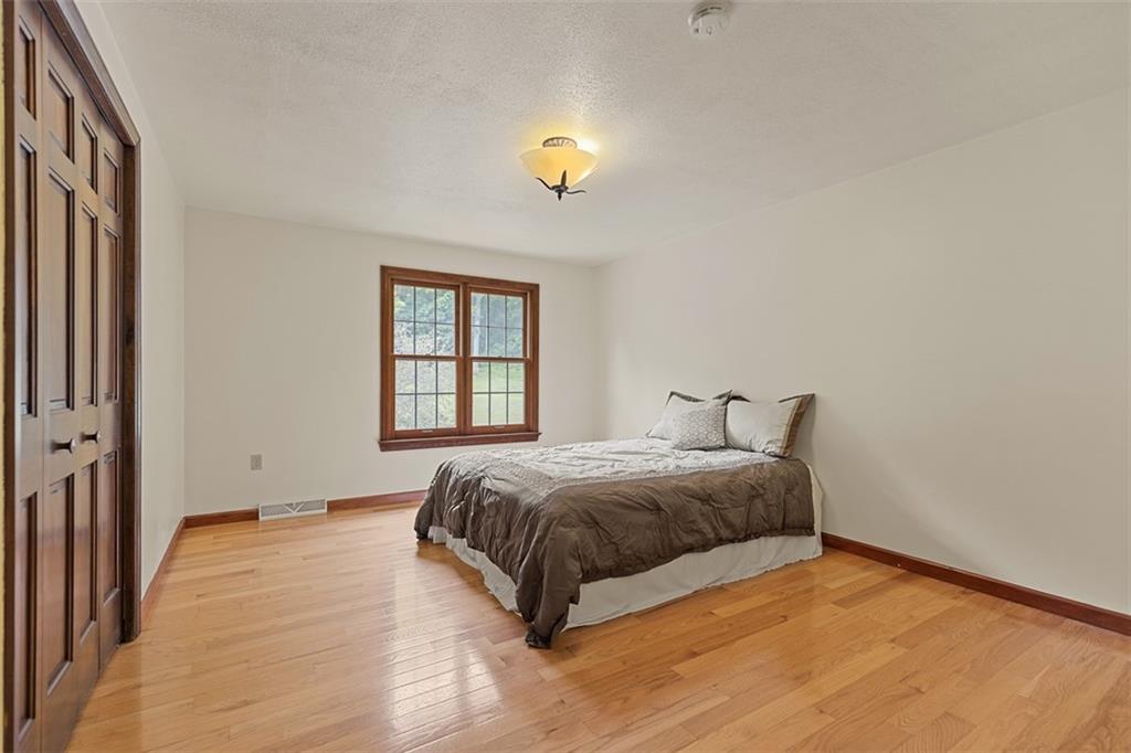 5150 Mamont Road Murrysville, PA 15668 - Photo 30 of 50 a bedroom with a bed and a window