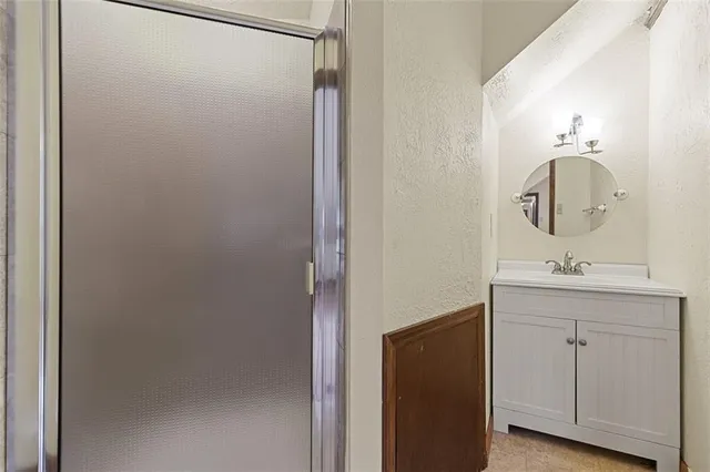 a bathroom with a sink and mirror