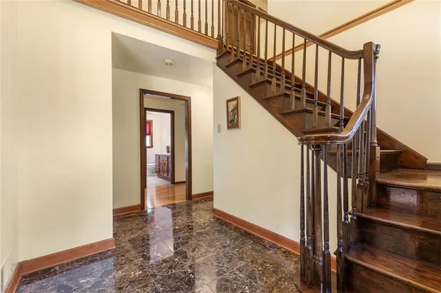 a view of an entryway with wooden floor