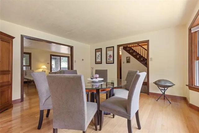 a workspace room with furniture and wooden floor
