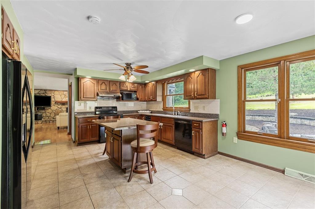 5150 Mamont Road Murrysville, PA 15668 - Photo 10 of 50 a kitchen with a sink cabinets and stainless steel appliances