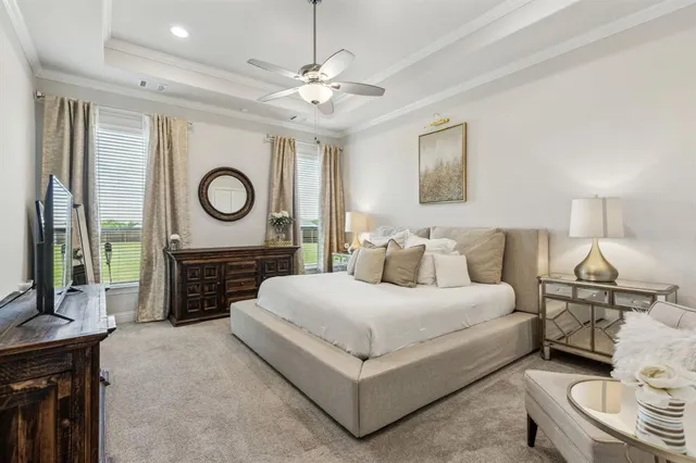 a living room with a bed furniture and a fireplace