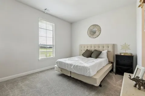 a bedroom with a bed and a closet