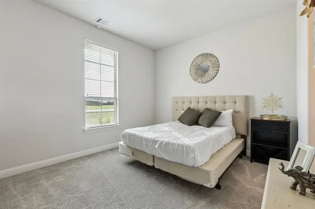 a bedroom with a bed and a closet