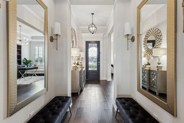 a view of a hallway view with wooden floor and furniture