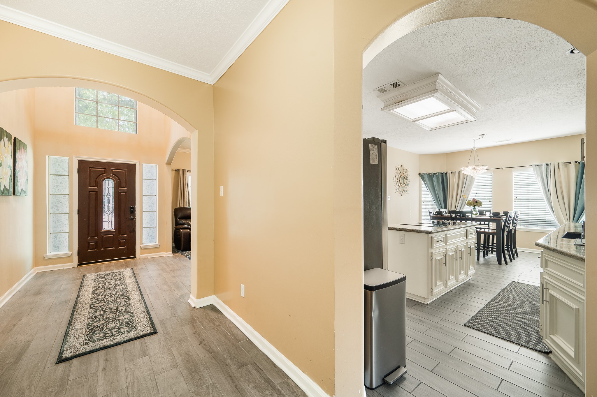 8111 Morningbrook Court Spring, TX 77379 - Photo 9 of 46 a view of kitchen with furniture and wooden floor