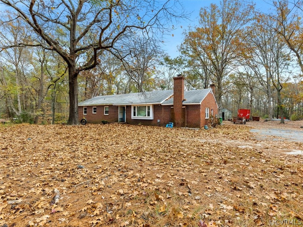 8343 Hull Street Road North Chesterfield, VA 23235 - Photo 2 of 7 a front view of a house with a yard