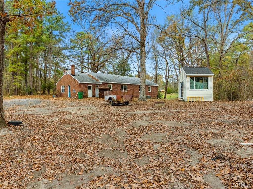 8343 Hull Street Road North Chesterfield, VA 23235 - Photo 3 of 7 a front view of a house with a yard
