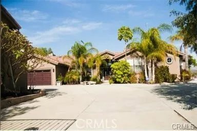a view of a house with a snow on the road