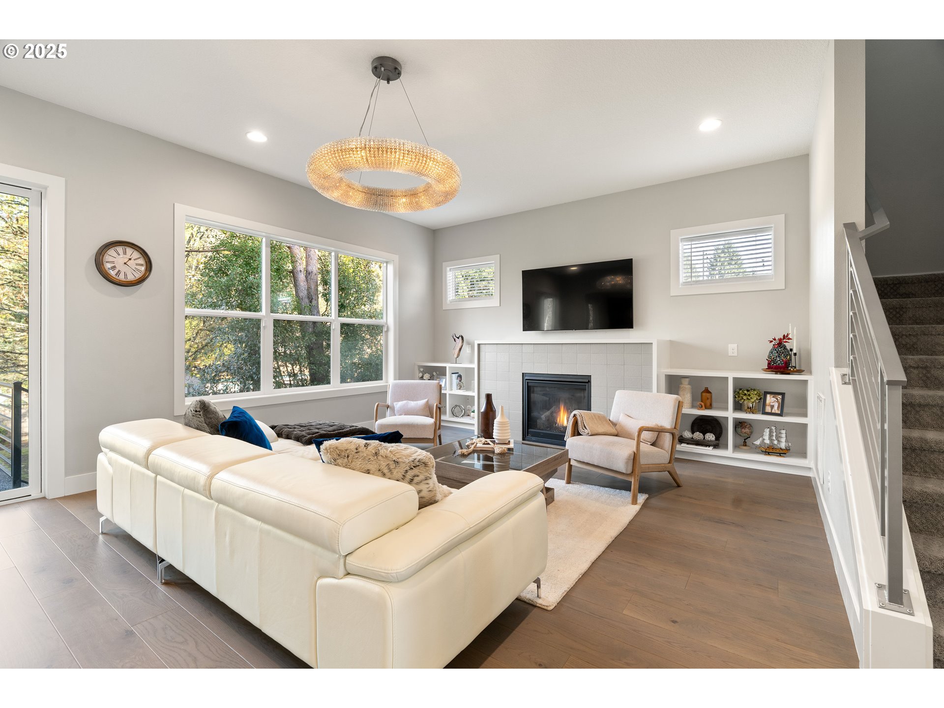 10805 Northwest Cornell Road Portland, OR 97229 - Photo 22 of 39 a living room with furniture a fireplace and a flat screen tv