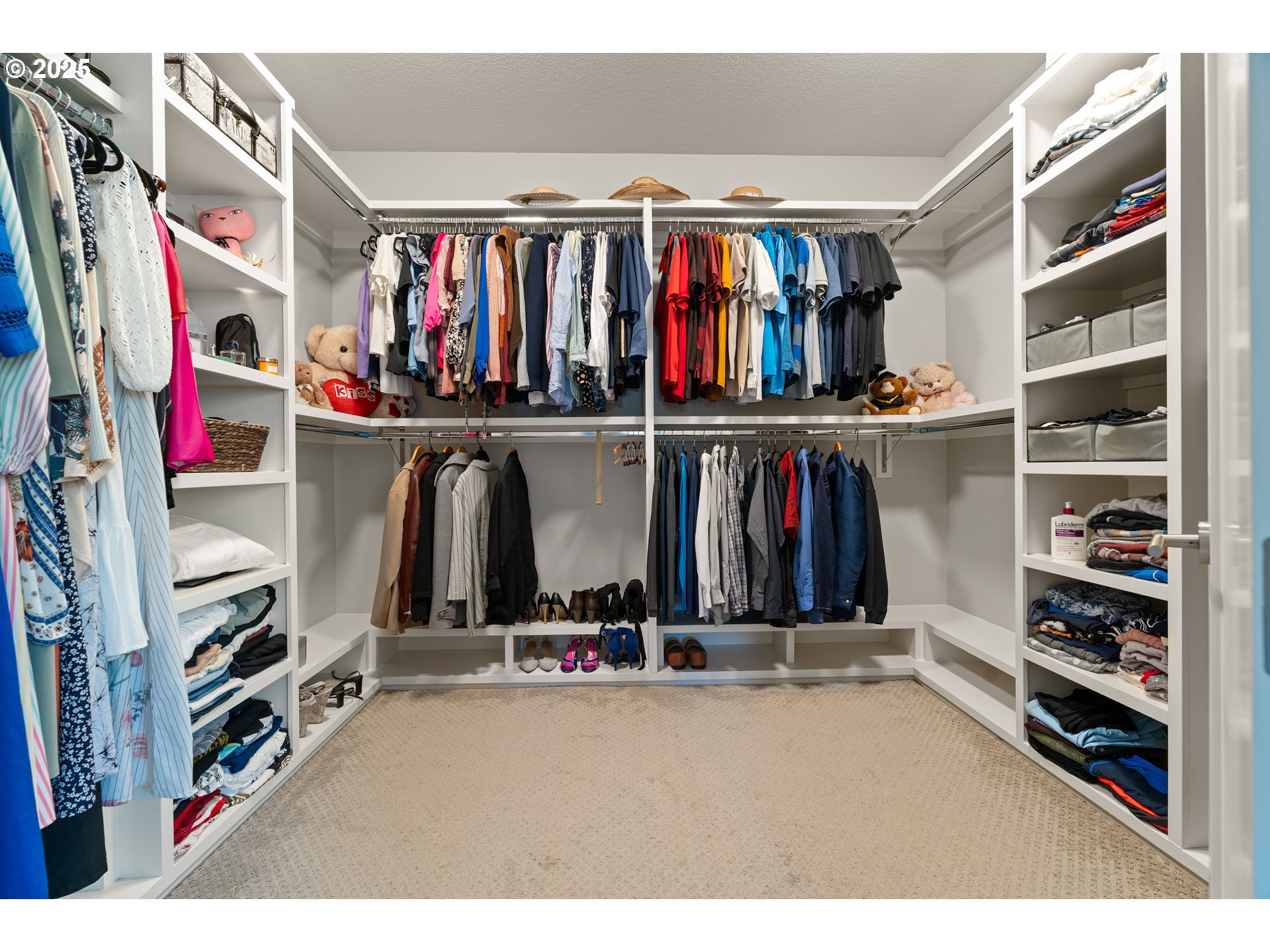 10805 Northwest Cornell Road Portland, OR 97229 - Photo 29 of 39 a view of walk in closet with clothes and shoes