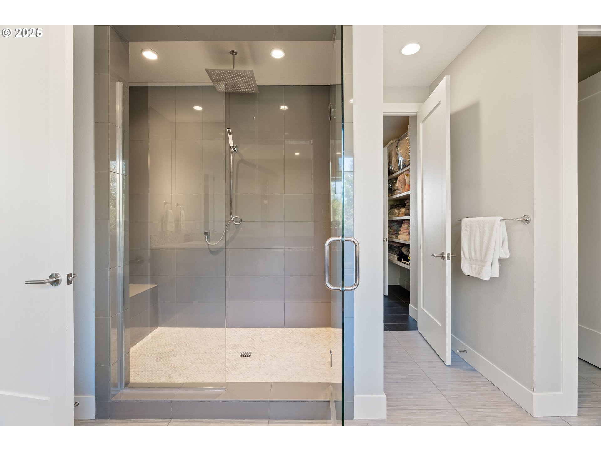 10805 Northwest Cornell Road Portland, OR 97229 - Photo 30 of 39 a bathroom with a glass shower door