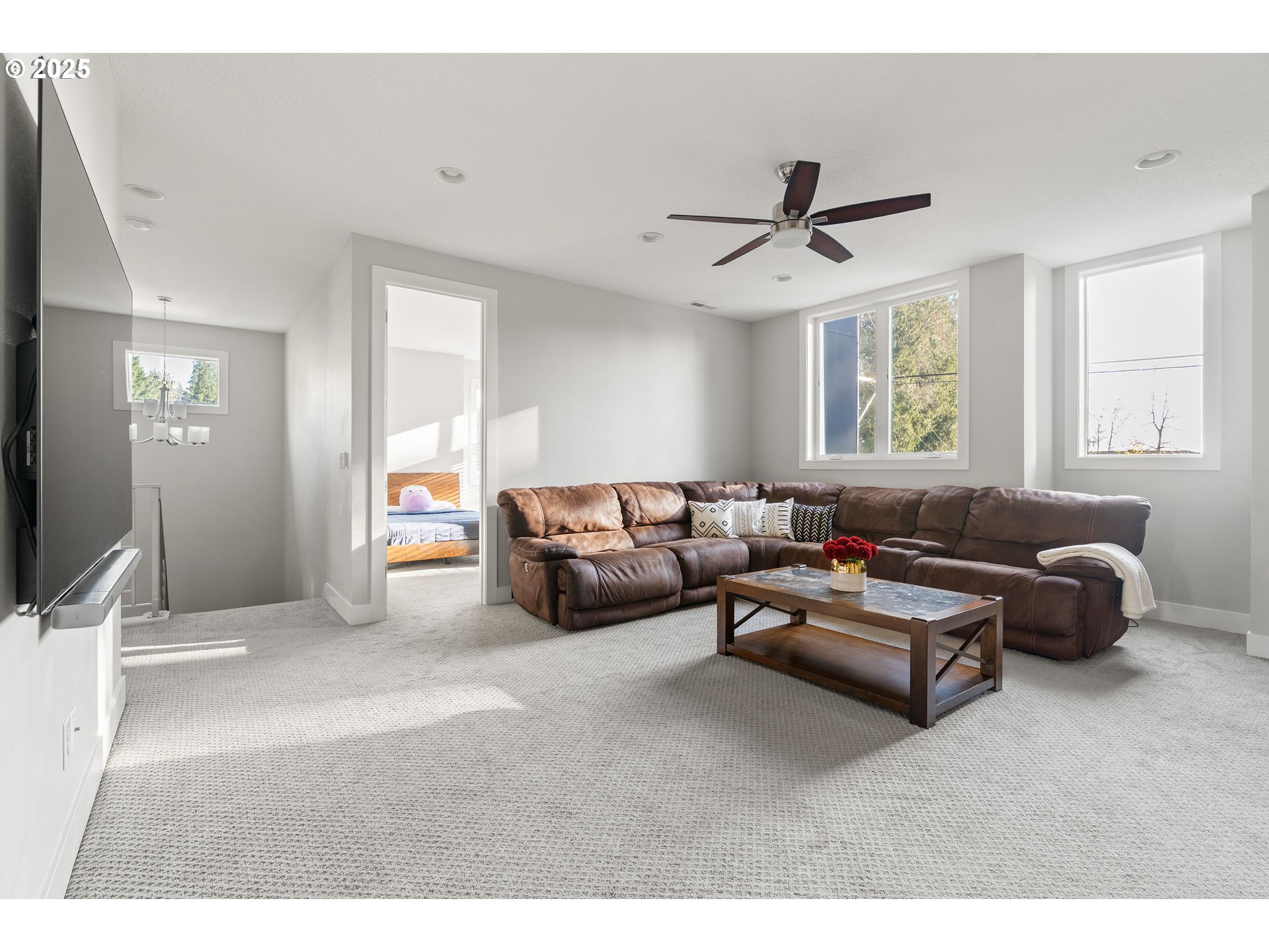 10805 Northwest Cornell Road Portland, OR 97229 - Photo 32 of 39 a living room with furniture ceiling fan and a window