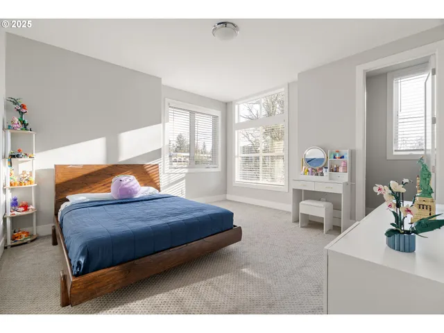 a bathroom with a double vanity sink mirror and toilet