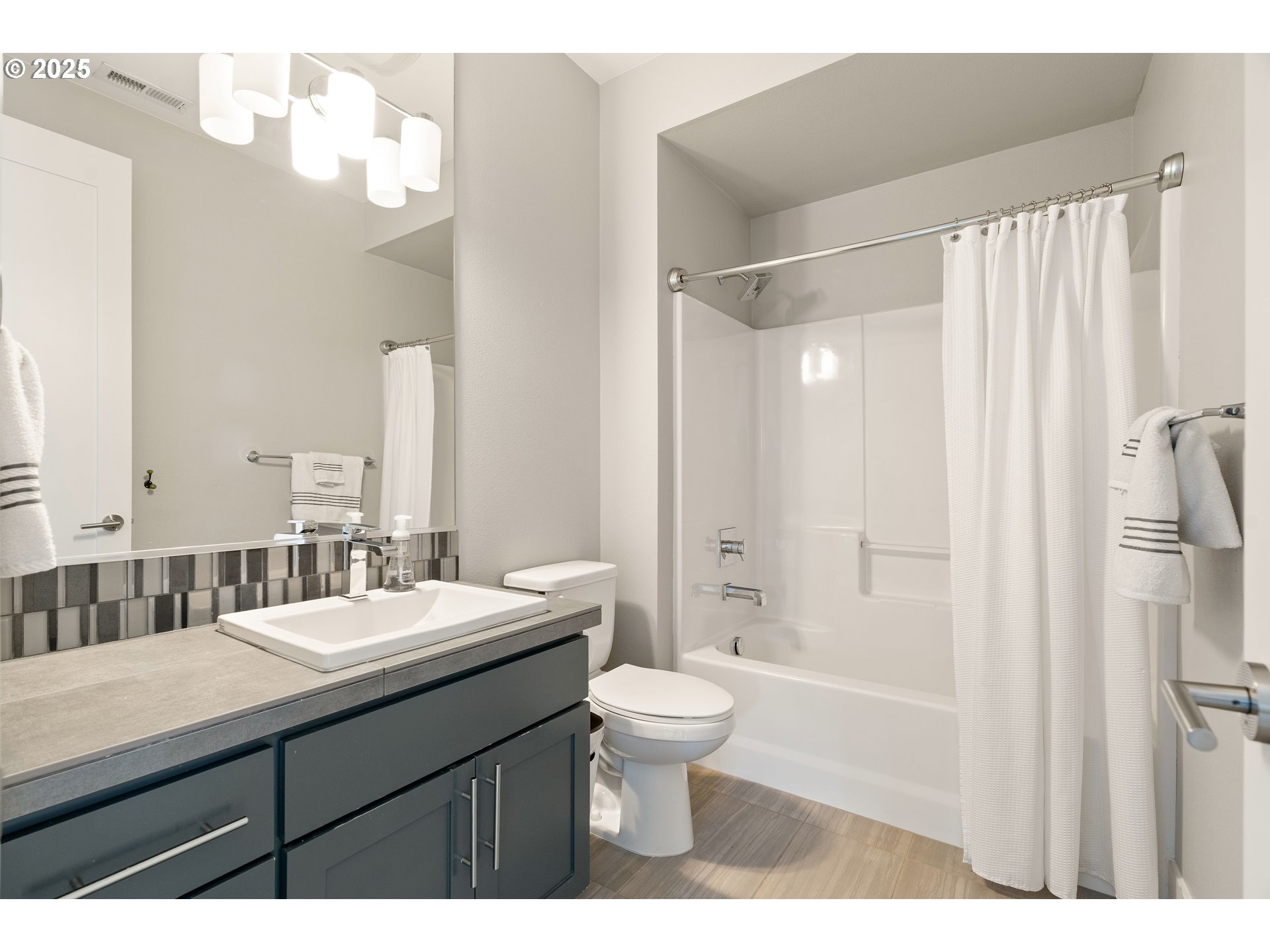 10805 Northwest Cornell Road Portland, OR 97229 - Photo 35 of 39 a bathroom with a double vanity sink mirror and toilet