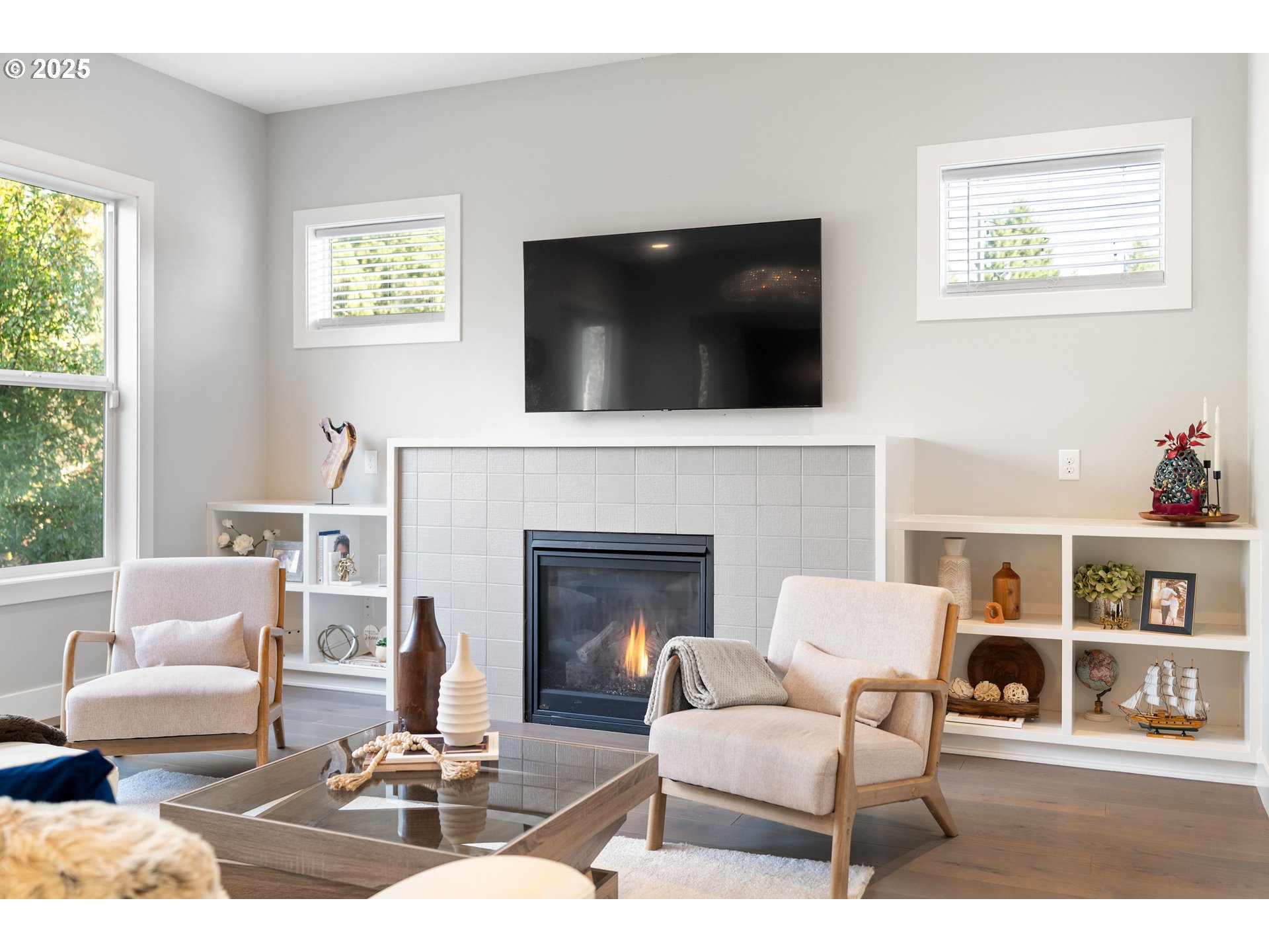 10805 Northwest Cornell Road Portland, OR 97229 - Photo 7 of 39 a living room with furniture a flat screen tv and a fireplace
