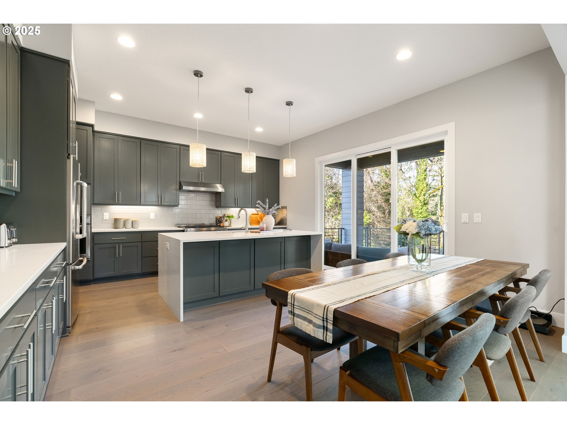 10805 Northwest Cornell Road Portland, OR 97229 - Photo 9 of 39 a kitchen with a table chairs sink and cabinets
