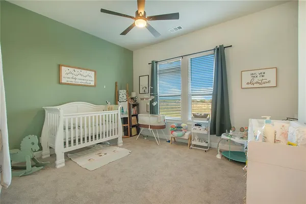 a bedroom with furniture and a window