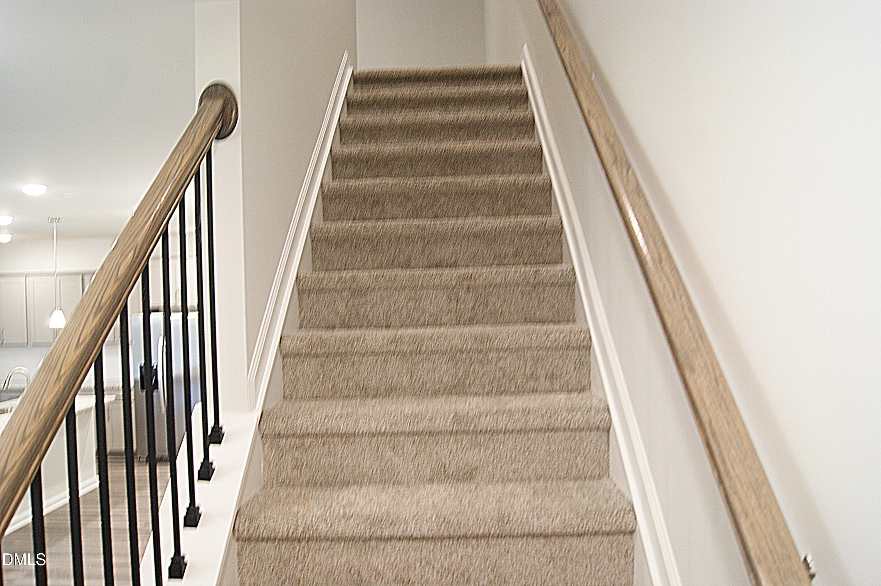 295 Glenmore Gardens Road Raleigh, NC 27603 - Photo 9 of 30 a view of staircase with white walls
