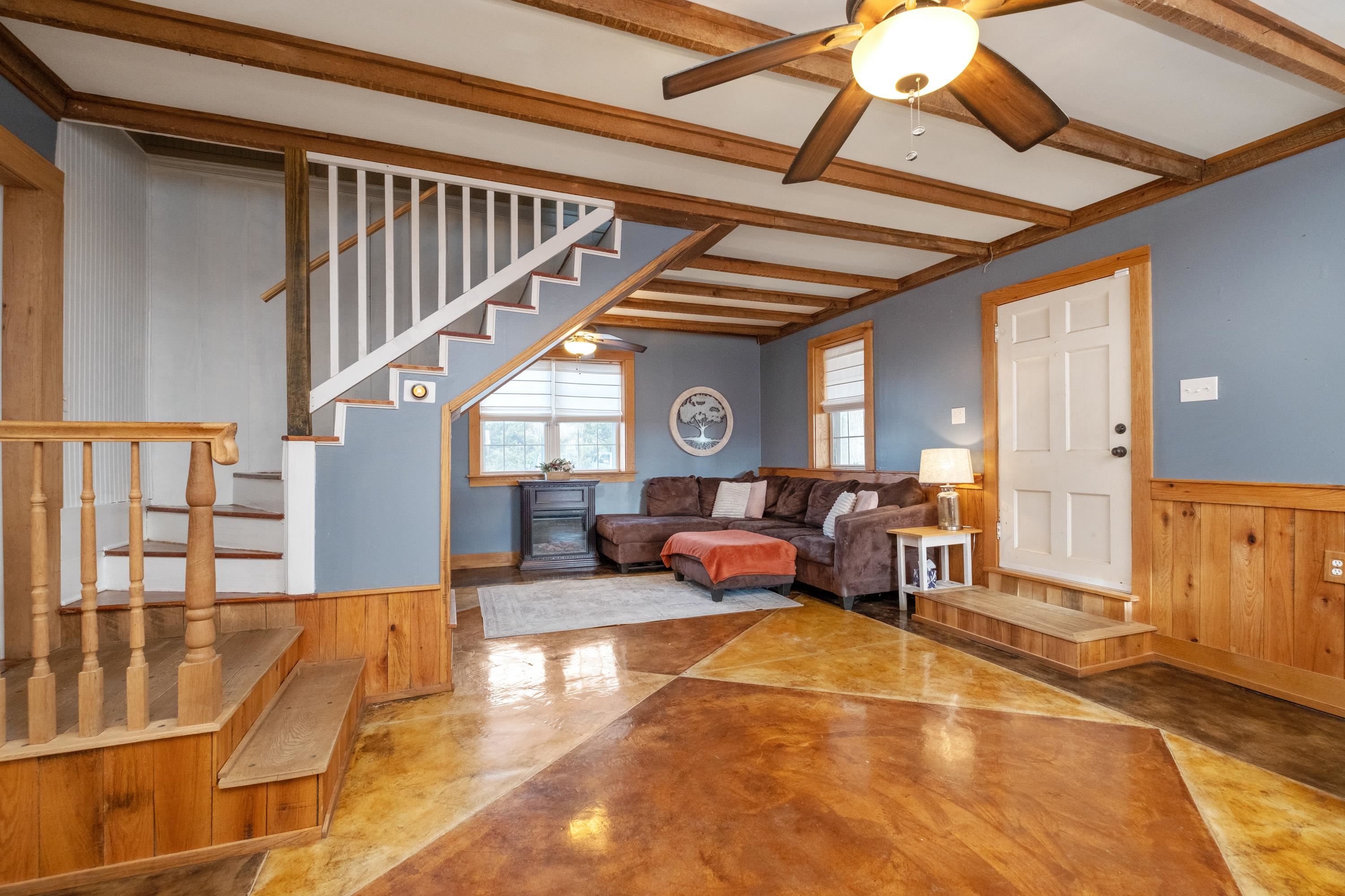 26 Battlefield Road Staunton, VA 24401 - Photo 4 of 44 a living room with furniture and a chandelier