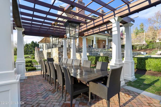 a view of a dining room with furniture wooden floor and a potted plant