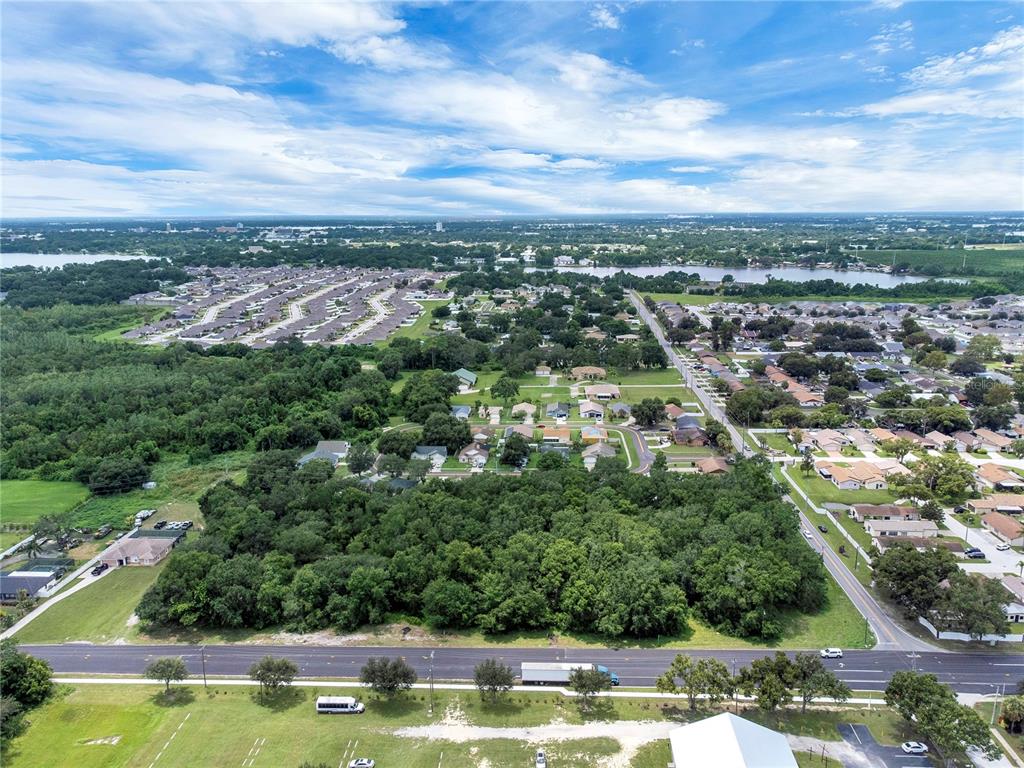 2400 Lake Buckeye Road Winter Haven, FL 33881 - Photo 2 of 16 an aerial view of residential houses with outdoor space and swimming pool