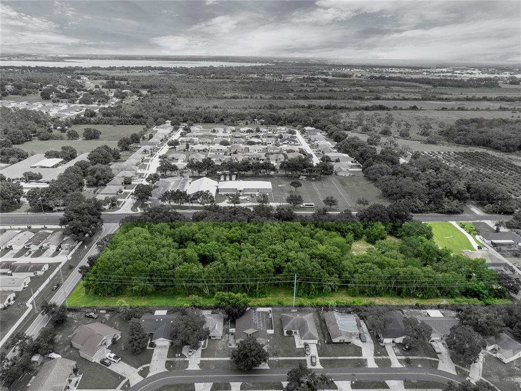 2400 Lake Buckeye Road Winter Haven, FL 33881 - Photo 3 of 16 an aerial view of a city with lots of residential buildings