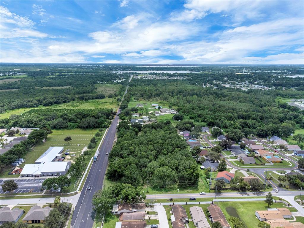 2400 Lake Buckeye Road Winter Haven, FL 33881 - Photo 6 of 16 an aerial view of a city with lots of residential buildings