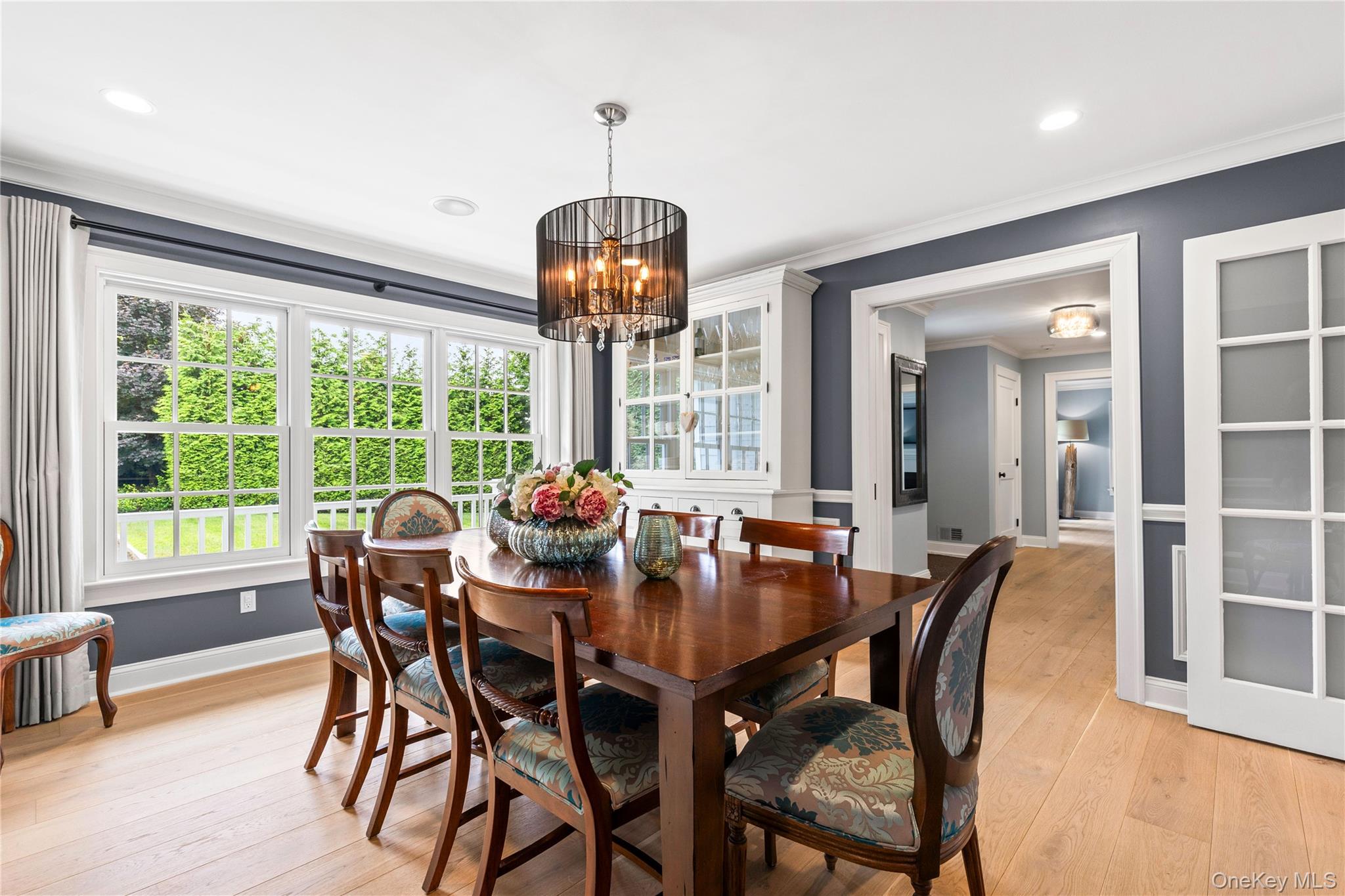 394 Park Avenue Rye, NY 10580 - Photo 12 of 36 Wainscoting walls and picture windows overlooking the picturesque front yard