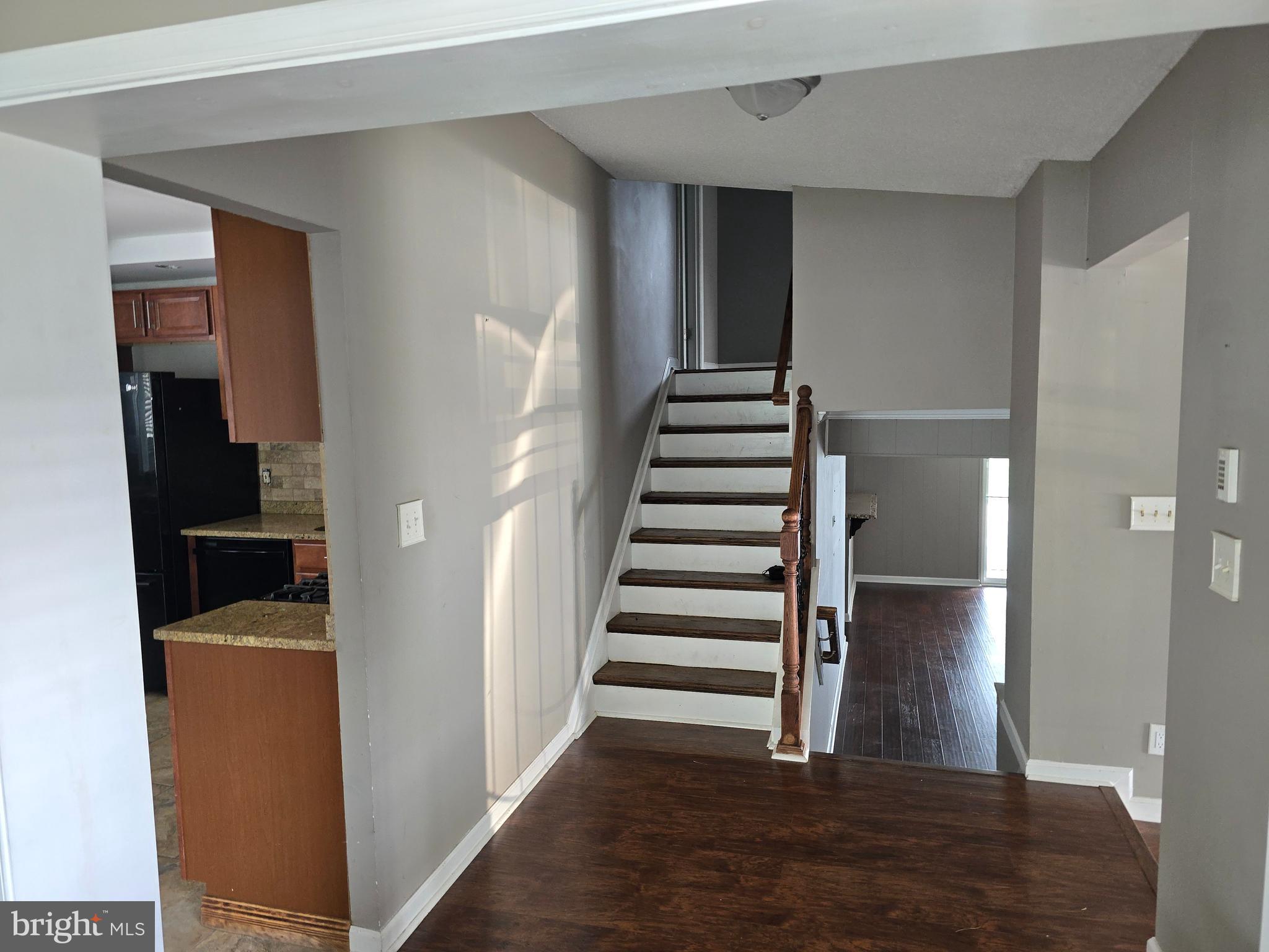 8343 Scotts Level Road Pikesville, MD 21208 - Photo 18 of 33 a view of entryway and hall with wooden floor
