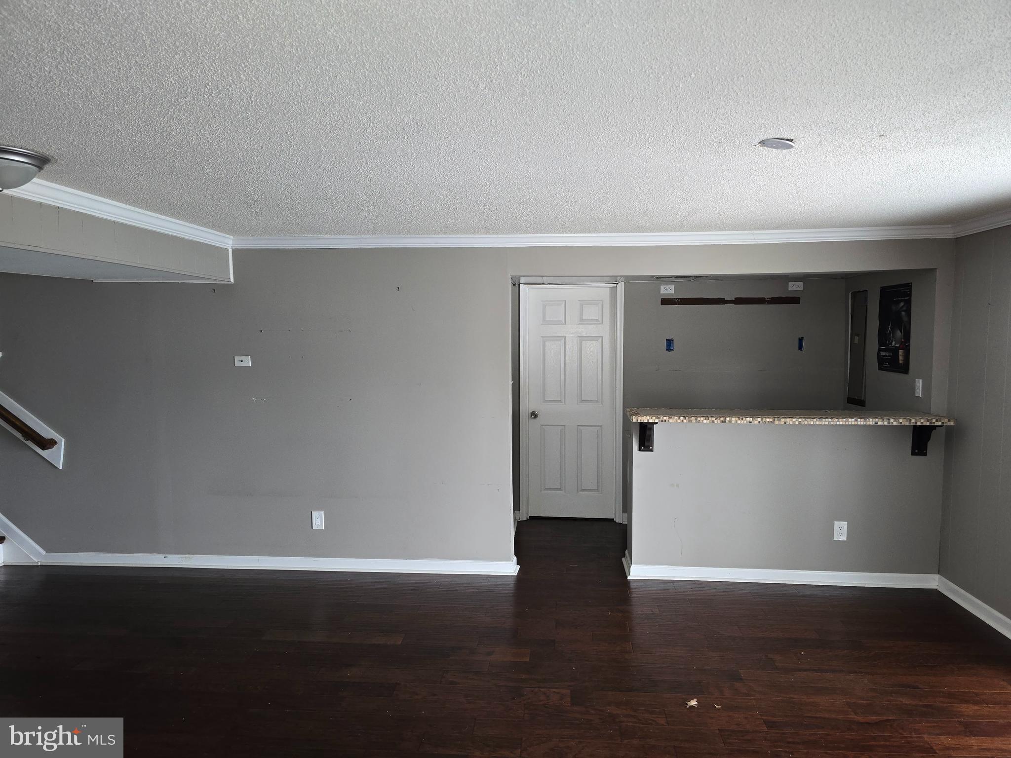 8343 Scotts Level Road Pikesville, MD 21208 - Photo 20 of 33 a view of empty room with wooden floor