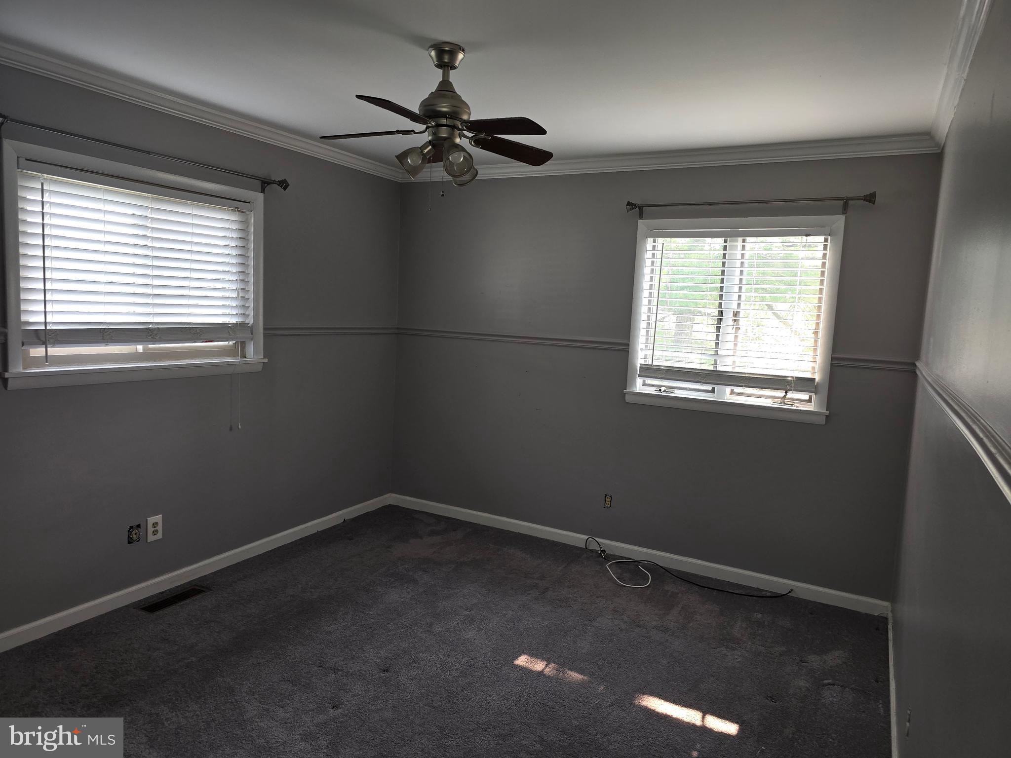 8343 Scotts Level Road Pikesville, MD 21208 - Photo 31 of 33 a view of a livingroom with a ceiling fan and window