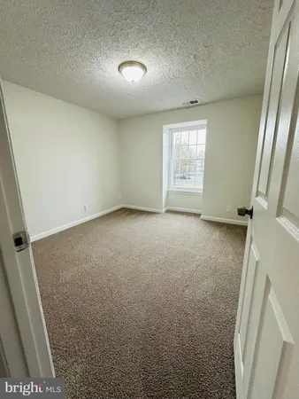 a view of hallway with wooden floor