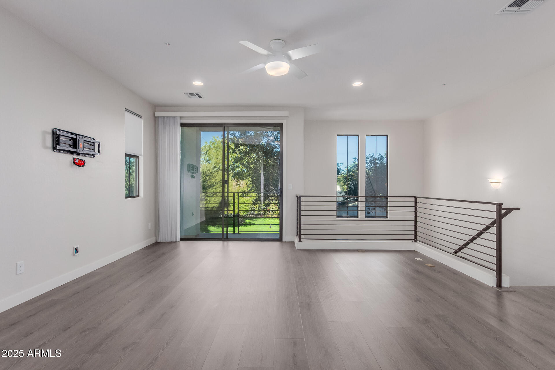 4235 North 26th Street, Unit 1 Phoenix, AZ 85016 - Photo 10 of 62 a view of a room with wooden floor and window