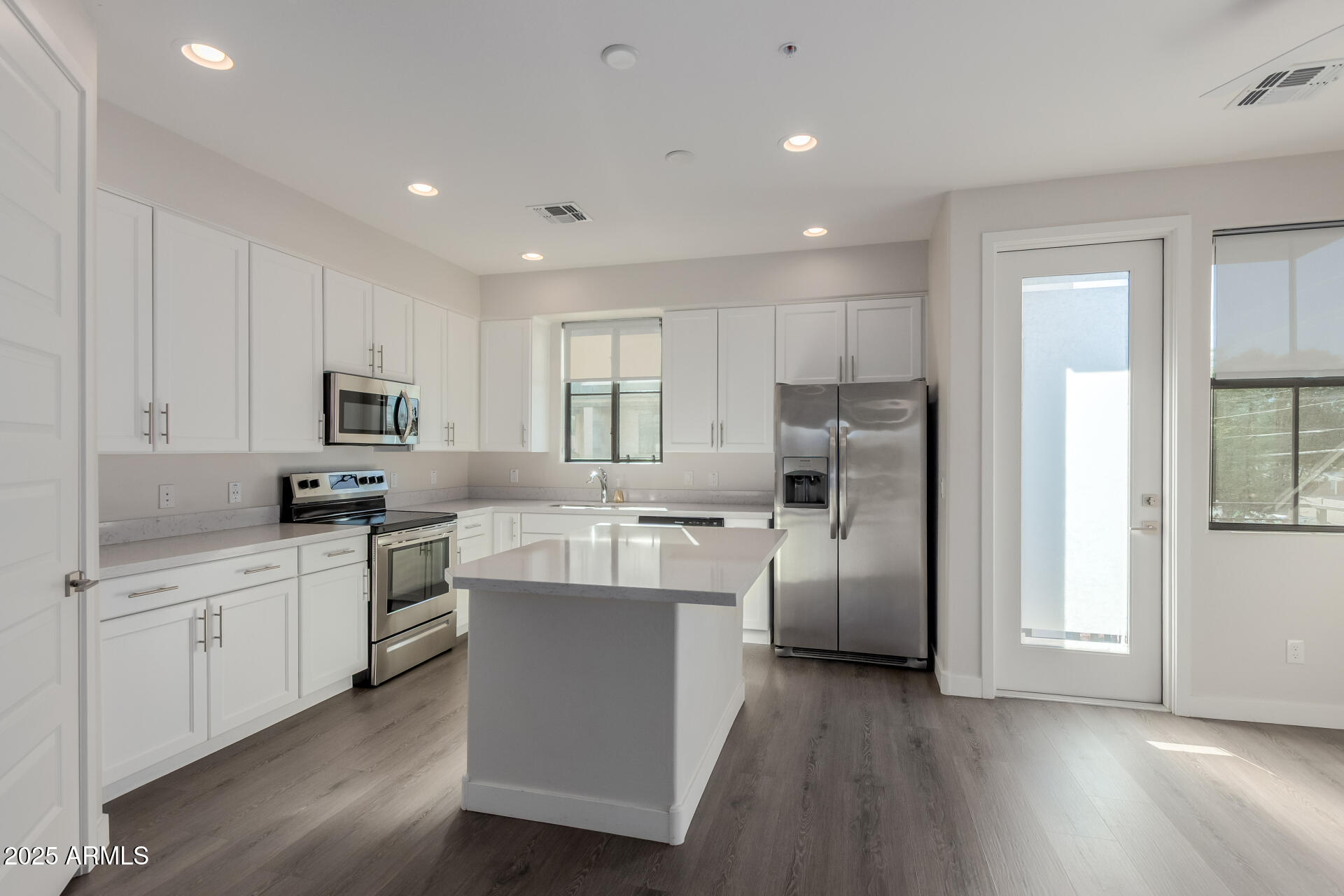 4235 North 26th Street, Unit 1 Phoenix, AZ 85016 - Photo 13 of 62 a kitchen with cabinets and stainless steel appliances